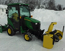 A photo of a green John Deere X370 Lawn Mower